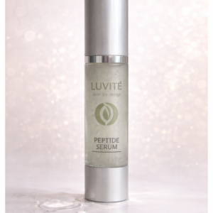 Luvité Barrier Repair Peptide Serum in frosted glass bottle with silver pump, soft neutral background