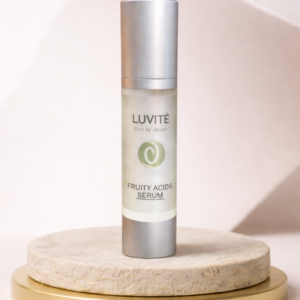 Luvité Fruity Acids Serum luxury skincare bottle on beige pedestal