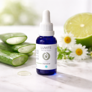 Luvité Renew serum with aloe vera, citrus slices and chamomile flowers on bright natural surface